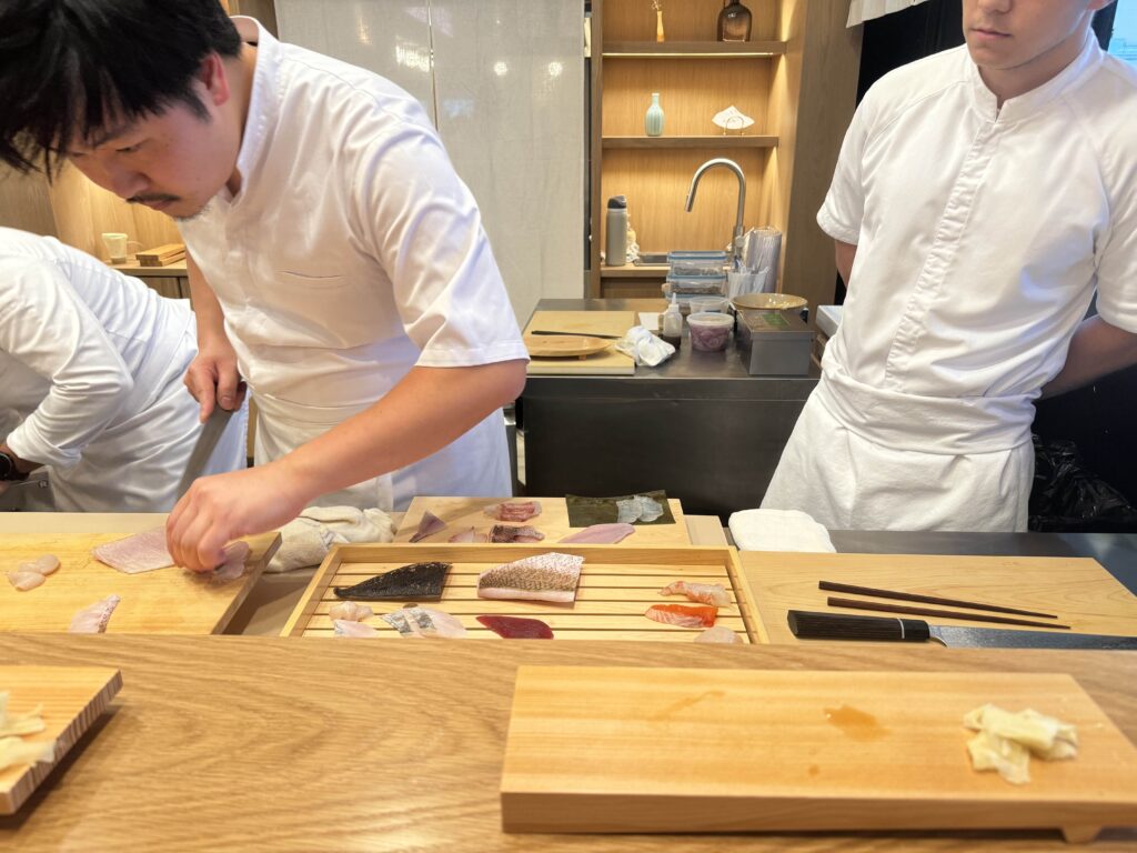 Picture of chef behind sushi counter at Okonomi