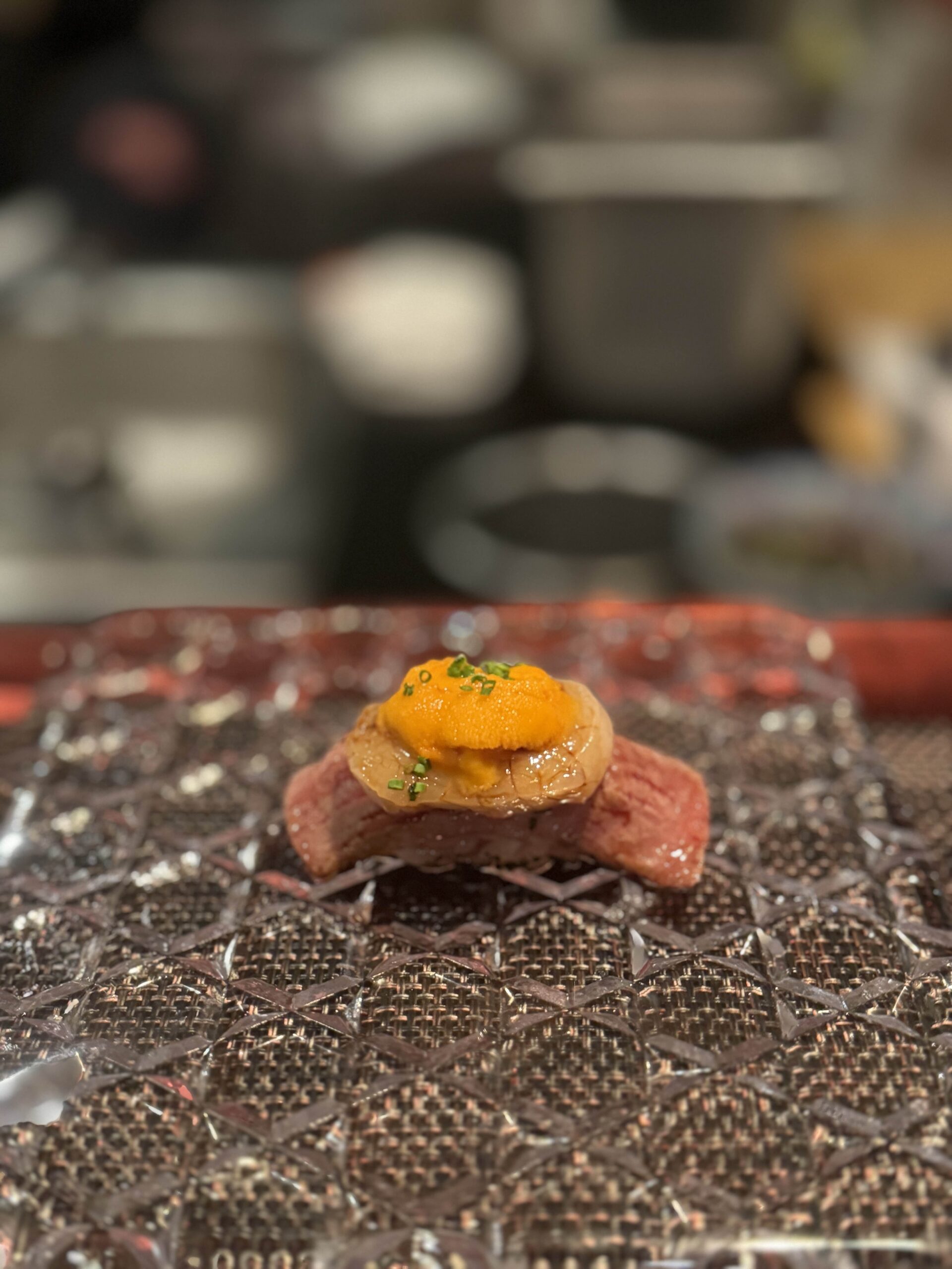 Picture of wagyu nigiri sushi with scallop and uni